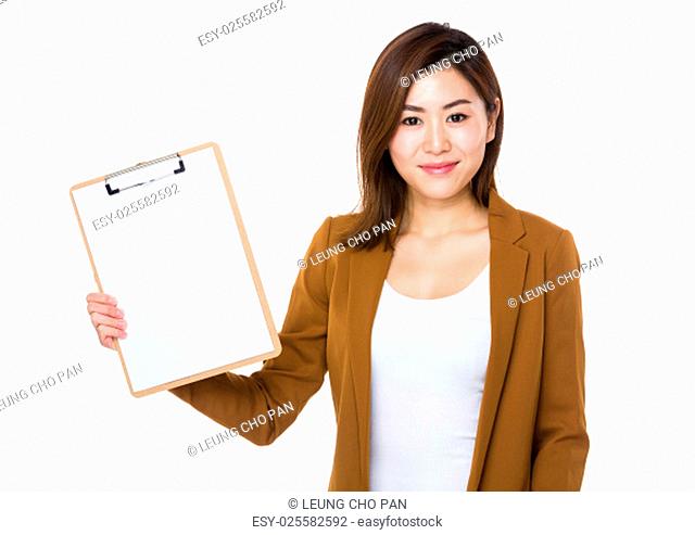 Young businesswoman show with blank page of clipboard