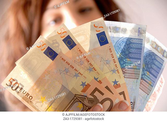 Woman holding Euro notes