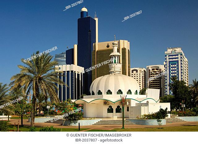 Modern mosque in front of skyscrapers in Abu Dhabi, United Arab Emirates, Middle East