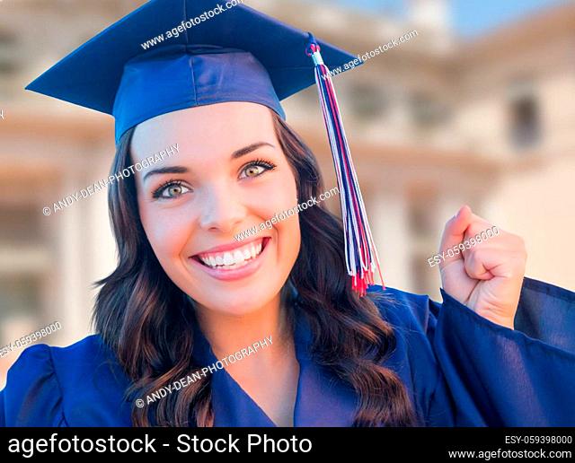 Happy Graduating Mixed Race Woman In Cap and Gown Celebrating on Campus