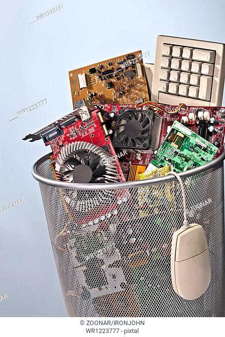 Paper basket full of electronic waste
