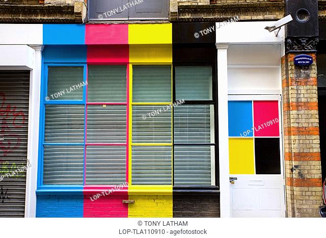England, London, London, Colourful shop front and window, decorated with CMYK cyan, magenta, yellow and black stripes and squares