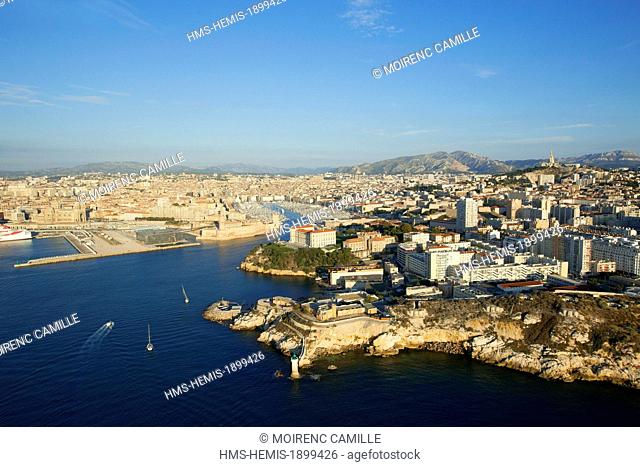 France, Bouches du Rhone, Marseille, Pharo, Pharo Palace and the Vieux Port and the Basilique Notre Dame de la Garde in the background (aerial view)