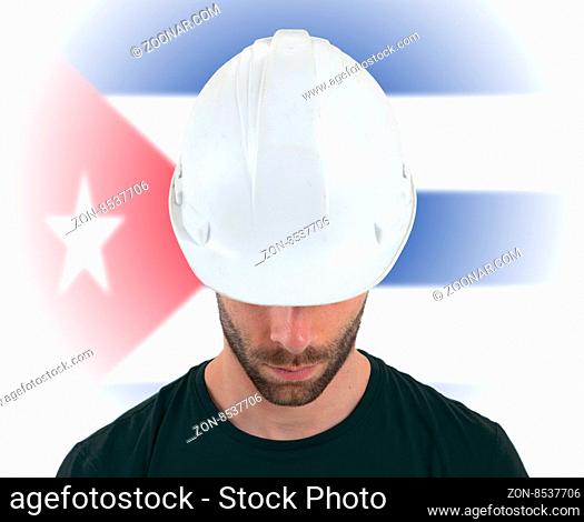 Isolated engineer with flag on background - Cuba