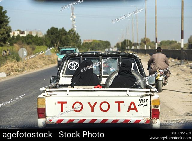 Passengers in the back of a pick-up truck, Kom-Ombo, Egypt, Northeastern Africa