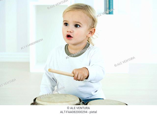 Baby boy playing drums