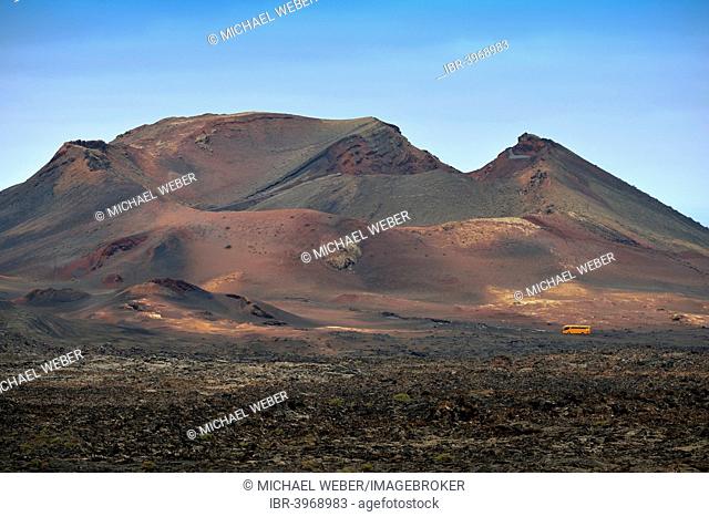 Guided bus tour through the Montanas del Fuego, Timanfaya National Park, Lanzarote, Canary Islands, Spain