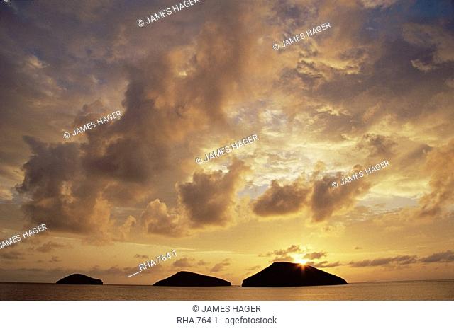 Sunrise behind Bainbridge Rocks, off James Island, Galapagos Islands, UNESCO World Heritage Site, Ecuador, Pacific, South America