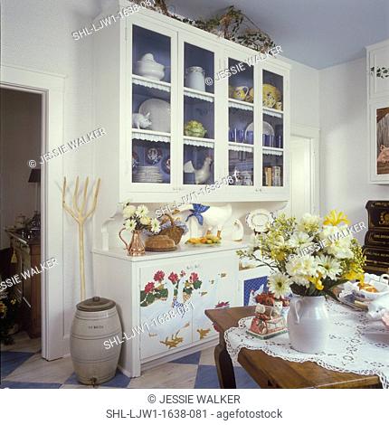 KITCHENS - Painted cabinet in country kitchen, lace tablecloth, faux painted geese, old wooden pitchfork, painted blue interior of cabinets