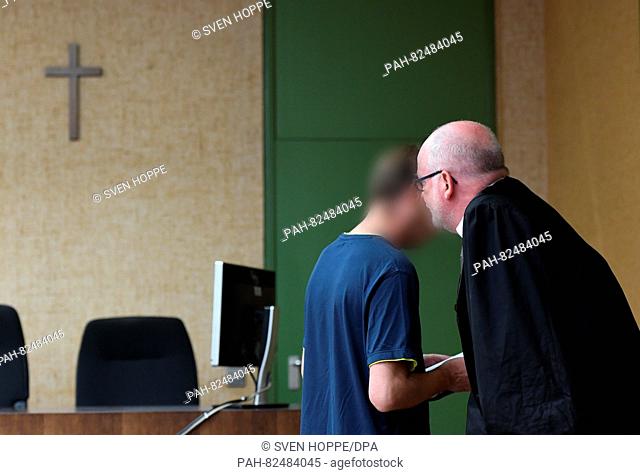 The defendant Juergen R. (L), a former religion teacher at the boarding school at Ettal Abbey on trial for sexual abuse, stands with his lawyer Jost...