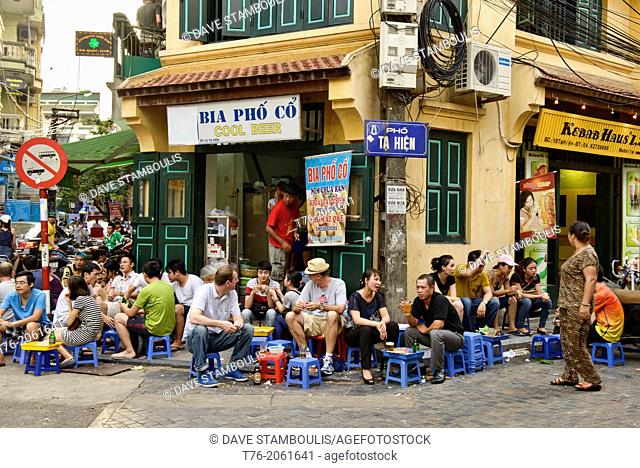 enjoying draft beer on the Bia Hoi Corner in Hanoi, Vietnam