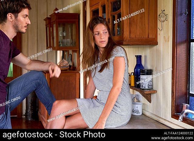 Young couple relaxing in kitchen