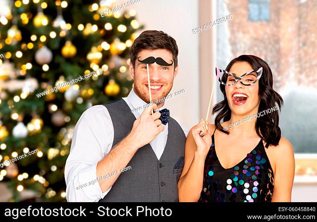 couple with party props having fun on christmas