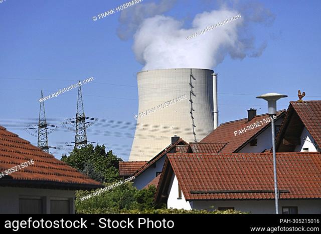 House roofs in Niederaichbach - the mighty cooling tower is enthroned in the background. The nuclear power plant Isar (abbreviation KKI)