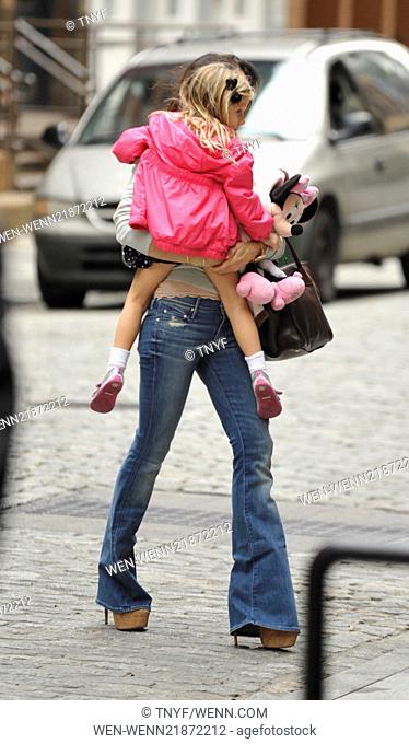 Bethenny Frankel, wearing bell bottom jeans and carrying a Prada bag, picks up her daughter Bryn from school Featuring: Bethenny Frankel