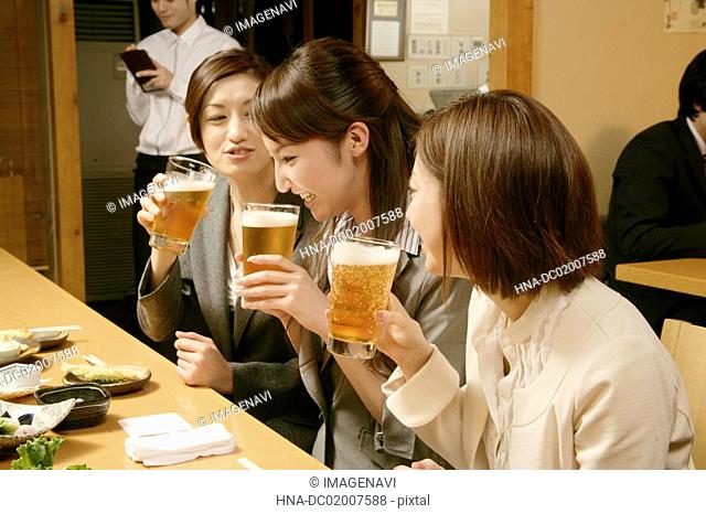 Women drinking beer in the Japanese-style pub