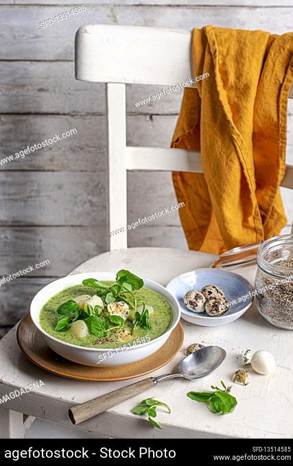 Watercress and new potato soup with quail eggs and black pepper
