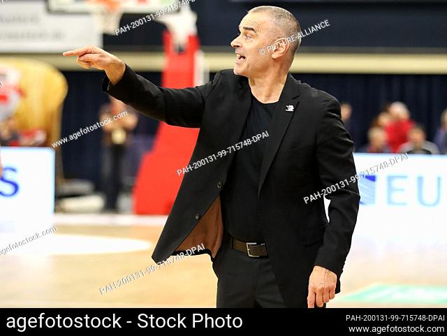 15 January 2020, Mecklenburg-Western Pomerania, Rostock: Dirk Bauermann, new coach of the Rostock Seawolves, gestures at his home game premiere in the...