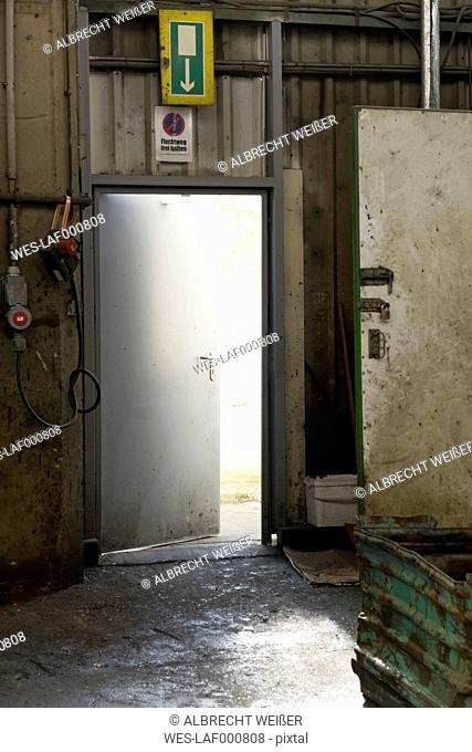 Escape door in a scrap metal recycling plant