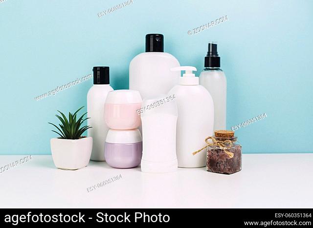 cosmetics jars and bottles near plant