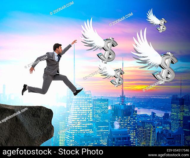 The businessman chasing angel dollars in business concept