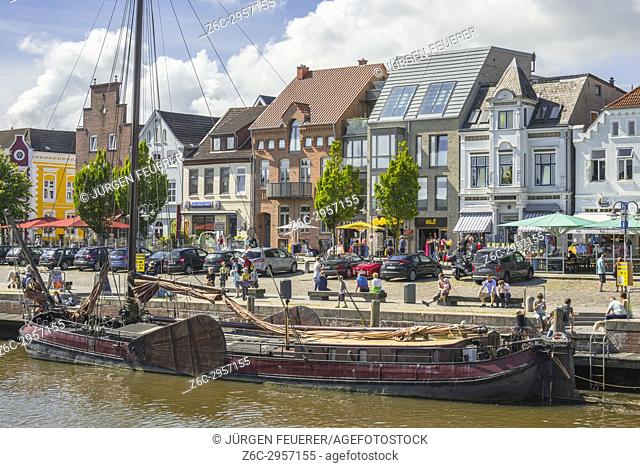 old sailing ship at the pier, inner harbour of the coastal town Husum at the North Sea, Germany