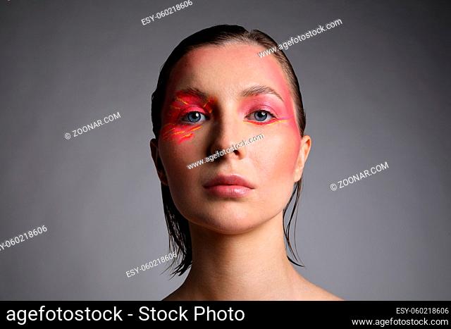 Headshot of caucasian beautiful woman with bright eyeshadow make-up. Isolated. High quality photo