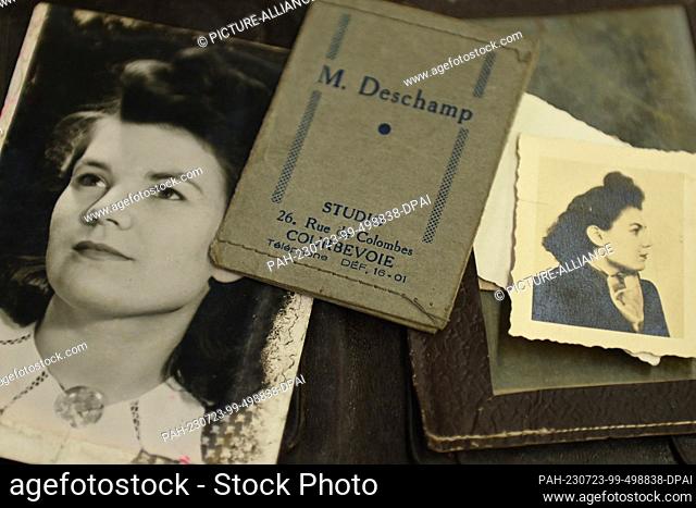 PRODUCTION - 11 July 2023, Hesse, Bad Arolsen: Pictures owned by former concentration camp inmates lie on a cabinet in the archive room of the Arolsen Archives