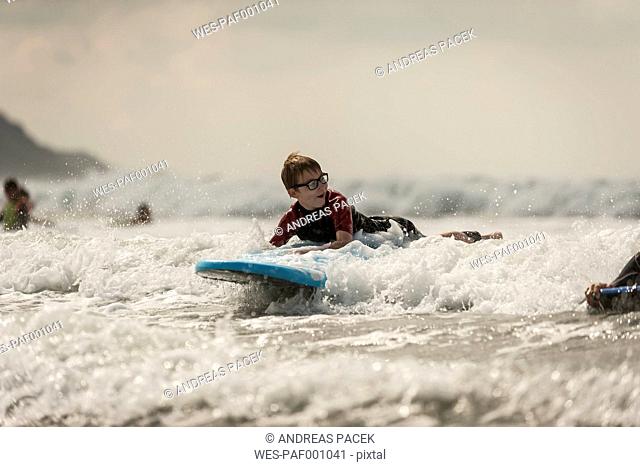 Boy surfboarding