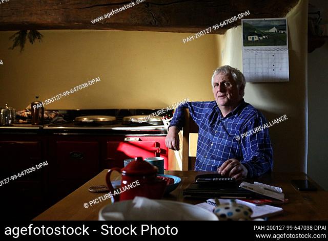 23 January 2020, United Kingdom, Betws-Y-Coed: Glyn Roberts, President of the Welsh National Farmer's Union, sits in the kitchen of his 300-year-old farmhouse...