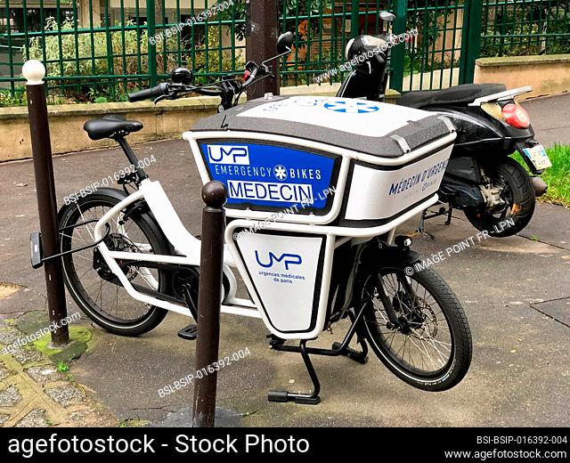 Electrically assisted bicycle for emergency doctors: its trunk can hold 150 liters of medical equipment. An insulated compartment allows the transport of...