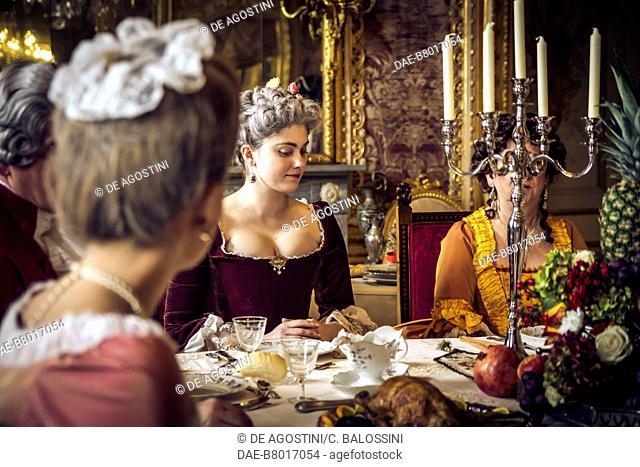 Lunch, table laid with candlestick, court life in the Stupinigi hunting lodge, Italy, 18th century. Historical re-enactment