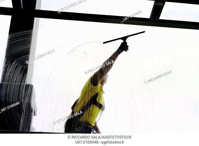 Germany, Berlin, Reichstag Dome, Man Cleaning Windows of the Dome