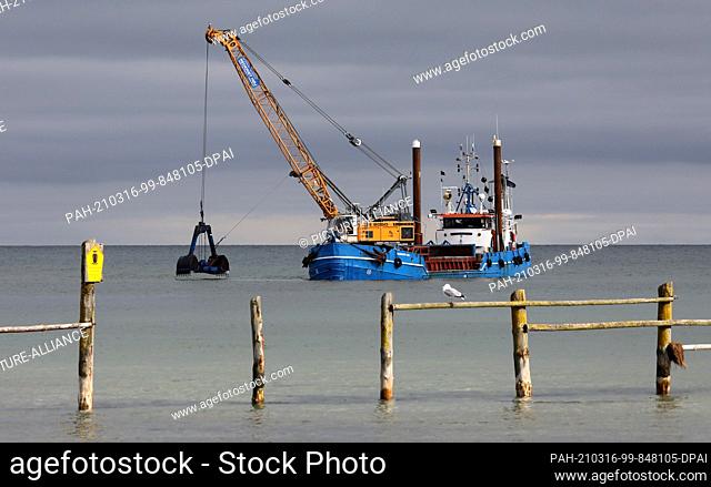 16 March 2021, Mecklenburg-Western Pomerania, Prerow: The dredger ""Elisabeth Høj"" is in operation at the access to the emergency harbour Darßer Ort in the...