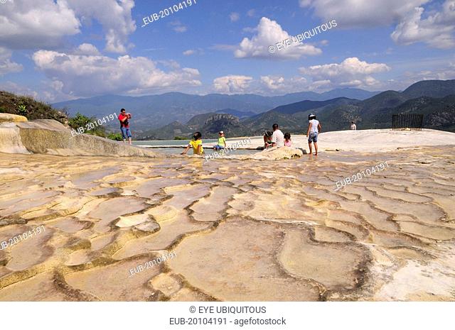 Tourists beside limestone pool