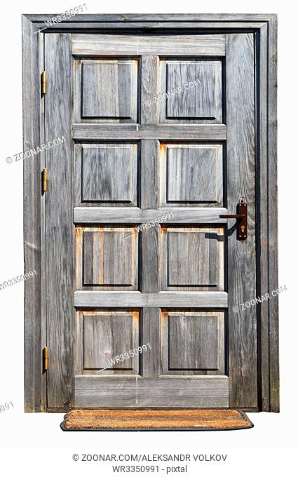 The door in the old rural shed is made of the non painted grown weathered old pine and fir-tree boards. Isolated