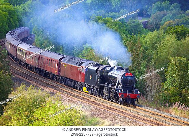 LMS Stanier Class 8F 48151, steam train near Low Baron Wood Farm Armathwaite Eden Valley, Cumbria, England, UK