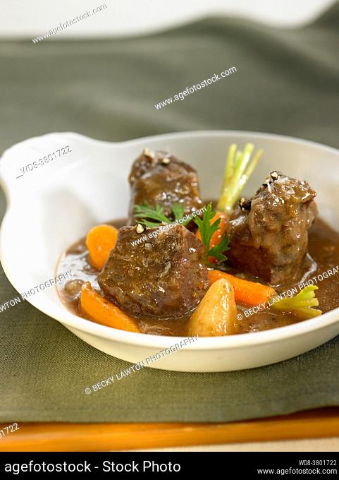 Beef ragu in wine, with potatoes, carrots and onion