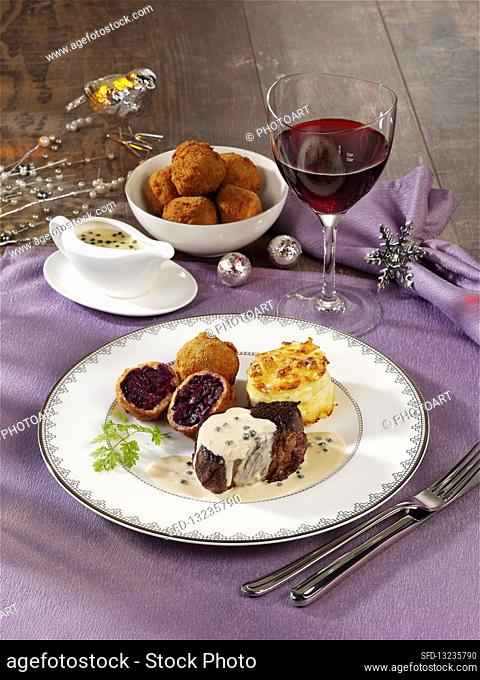 Beef fillet steak with red cabbage dumplings and potato gratin