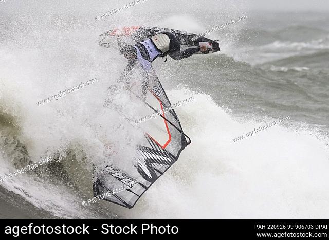 26 September 2022, Schleswig-Holstein, Westerland/Sylt: Day winner Philip Köster (Germany) surfs a wave during a competition in the discipline Wave at the...