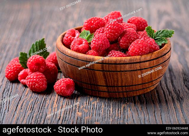 ripe raspberry isolated on a wooden table