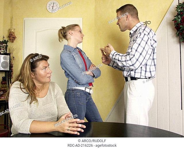 Father quarreling with daughter, mother listening
