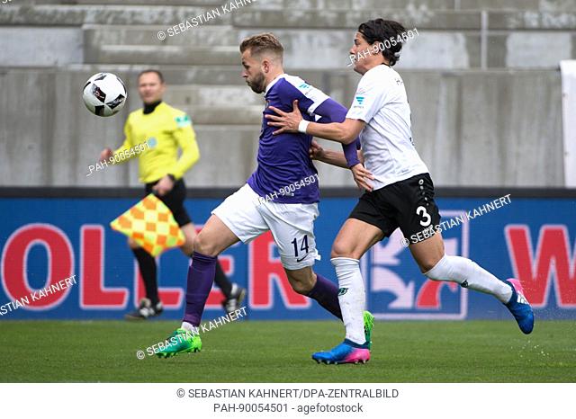 Aue's Pascal Koepke (l) and Hanover's Miiko Albornoz vie for the ball during the 2nd German Bundesliga soccer match between Erzgebirge Aue and Hanover 96 in the...