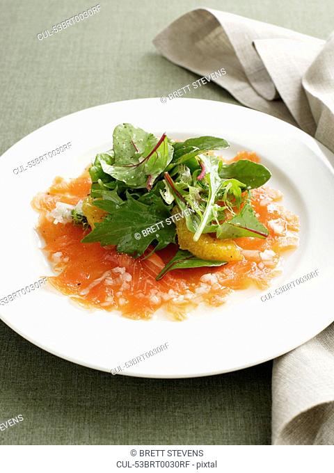 Plate of smoked salmon with salad