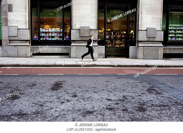 England, London, City of London. Man running