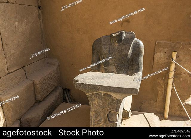 Headless seated statue in Temple of Karnak. El-Karnak, Luxor Governorate, Egypt, Africa, Middle East