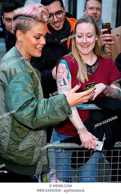 Singer Pink visiting BBC Radio studios to promote her album 'Beautiful Trauma'. Pink saw a fan who had a massive portrait tattoo of her face and stopped by to...