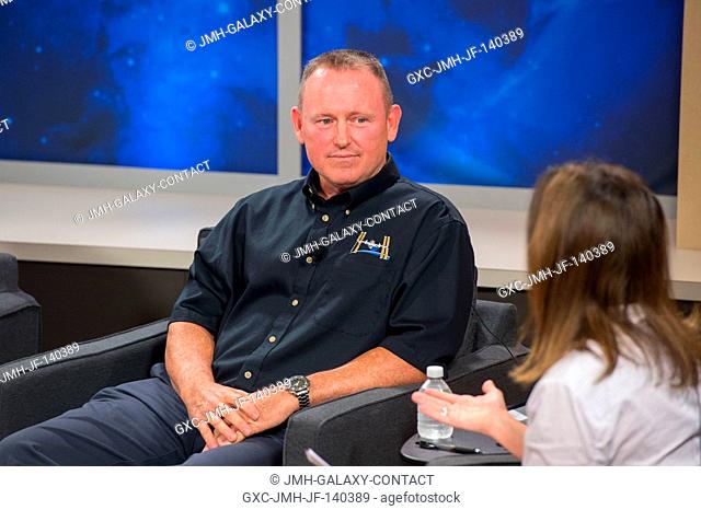 NASA astronaut Barry Wilmore, Expedition 41 flight engineer and Expedition 42 commander, and Public Affairs Office moderator Nicole Cloutier are pictured during...