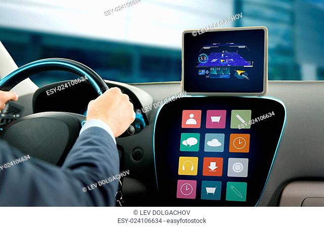 transport, business trip, technology, navigation and people concept - close up of young man with gps navigator on tablet pc and on-board computer menu driving...