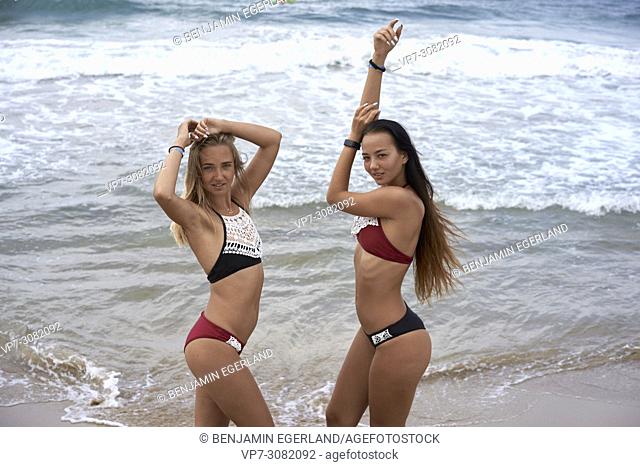 two women on beach, wearing bikini, feeling sexy. Greece, Crete, Malia